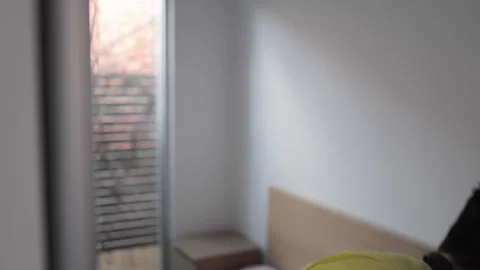 Construction worker getting dressed in morning before work Stock Footage 240395351