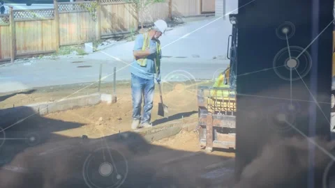 Construction worker grabbing rake and leveling curb soil, preparing form through Stock Footage 331045926