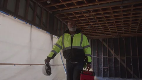 Construction Worker With Grey Beard Walking Through Job Site Stock Footage 270390216