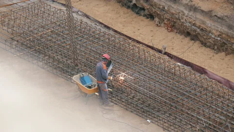 Construction Worker Grinding Metal on a Construction Site. Stock Footage 158238269