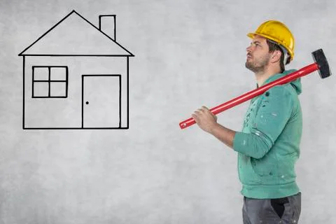 Construction worker with a hammer in hand, concept of construction and disass Stock Photos