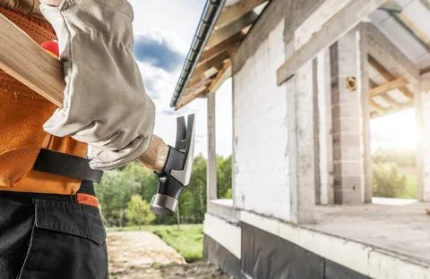 Construction Worker with a Hammer Tool in His Hand 写真素材