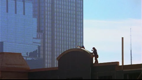 Construction worker hammering on archway Stock Footage 145617695