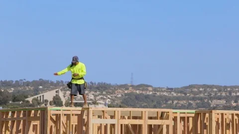 Construction Worker Hammering On Wooden Structure Stock Footage 91115393