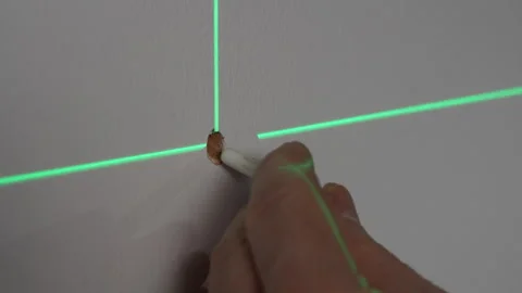 Construction worker hammers dowel in hole in wall and screw with screwdriver Stock Footage 306318334