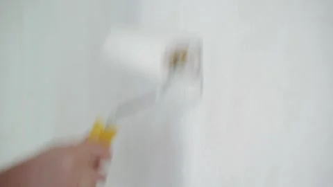 Construction worker hand painting the ceiling Stock Footage 265291886