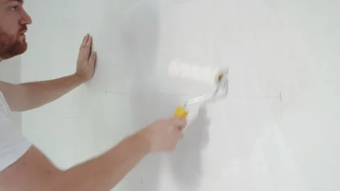 Construction worker hand painting the ceiling Stock Footage 265292209