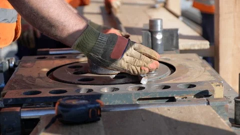 Construction worker hands bend steel reinforcing bar closeup Video stock 119985283