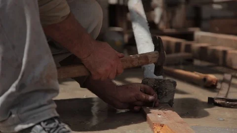Construction worker Hands close up at Site Knocking nails Stock Footage 127127658