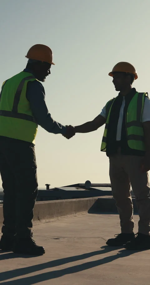 Construction worker, handshake and men with smile, outdoor and agreement for Stock Footage 345645754