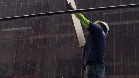 Construction worker hardhat building scaffolding wood planks New York City NYC Stock-Footage 162935596