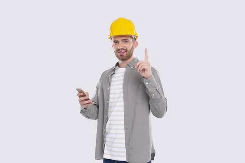 Construction Worker Having A Great Idea Holding Phone in Hands. Man with Idea Stock Photos