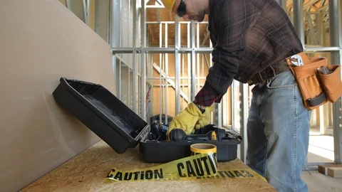 Construction Worker in His 30s Preparing His Tools For the Job. Hard Hat Area. Stock Footage 95598846