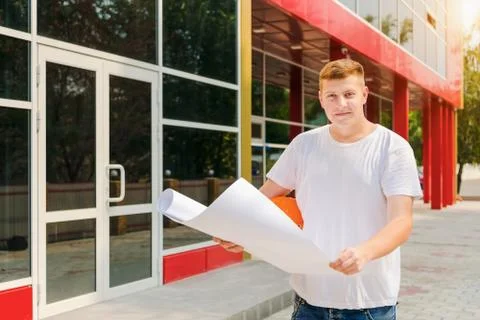 Construction worker hold plan of the building Stock Photos