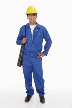 Construction worker holding a blueprint plan Stock Photos
