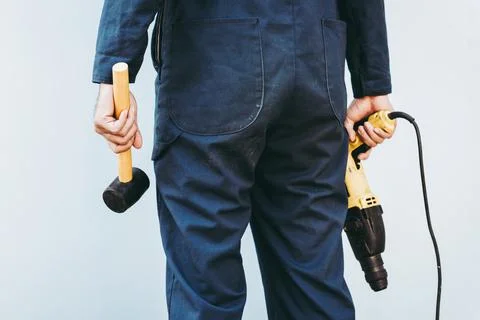 Construction Worker Holding Constructing Equipment Tools on Isolated Backgrou Stock Photos