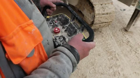 Construction worker holding controlling device Video stock 303137380