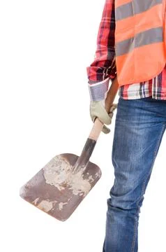 Construction worker holding a dirty used shovel on white background Stock Photos