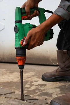 Construction Worker Holding Electric Demolition Hammer Drill. Stock Photos