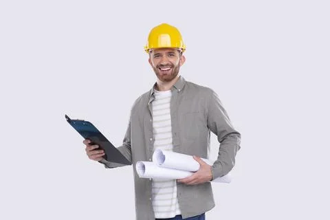 Construction Worker Holding House Plan and Clipboard in Hands. Architect Holding Stock Photos