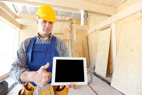 Construction worker holding tablet Stock Photos