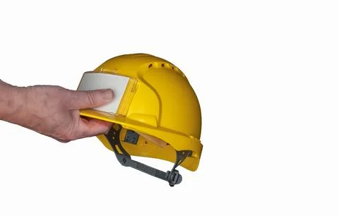 Construction worker holding yellow safety helmet Stock Photos