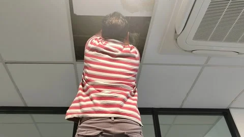 Construction Worker Inspecting Ceiling Leak Stock Footage 320525440