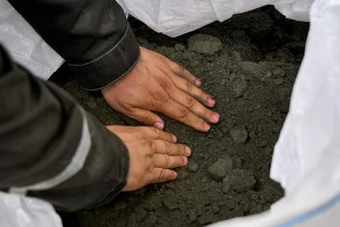 Construction Worker Inspecting Concrete Mix 스톡 사진