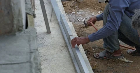Construction worker installing aluminum frame construction site action shot Stock Footage 333002388
