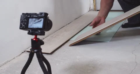 Construction worker installing laminate flooring planks Stock Footage 295196633