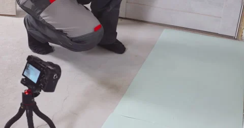 Construction worker installing modern laminate floor in house Stock Footage 295198154