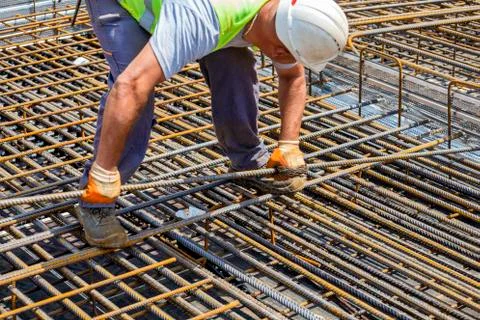 Construction worker installing rebar Stock Photos