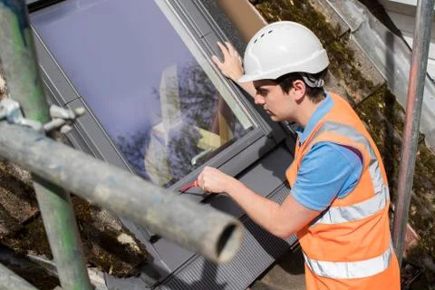 Construction Worker Installing Replacement Window Stock Photos