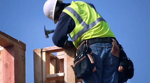 Construction worker installs the wooden column on the new building structure 스톡 동영상 34537419