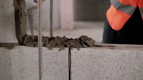 Construction worker laying bricks on cement close up Stock Footage 292660351