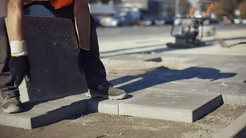 Construction Worker Laying Concrete Pavement On The Street Stock Footage 123228807