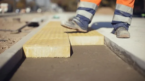 Construction Worker Laying Concrete Pavement On The Street Stock Footage 123961068