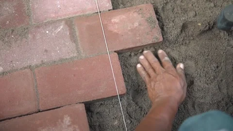 Construction Worker Leveling Sand Layer For Bricks Stock Footage 160036343