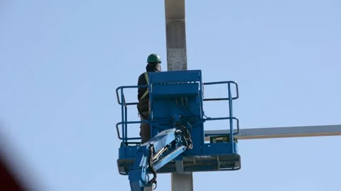 Construction worker on lift platform Stock-Footage 169742225