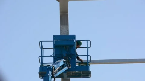 Construction worker on lift platform Stock Footage 169742226
