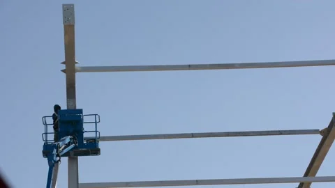 Construction worker on lift platform Stock Footage 169742229