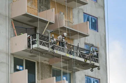 Construction worker looking down from a platform in Miami, Florida Stock Photos
