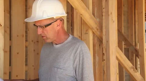 Construction worker looking over blueprints. Stock Footage 11821427