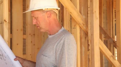 Construction worker looking over blueprints. Stock Footage 11821465