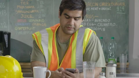 Construction worker looking at phone Stock-Footage 62254729