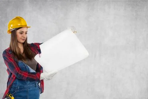 Construction worker looking at plans, copy space Stock Photos