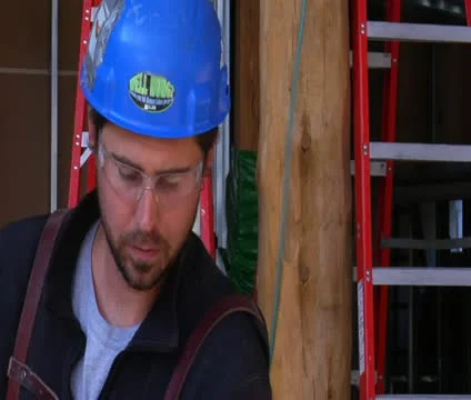 Construction worker looks in camera Stock Footage 21559119