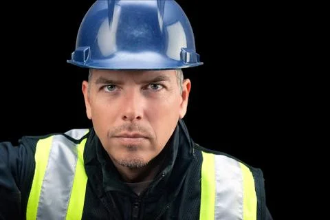 Construction worker looks to camera Stock Photos