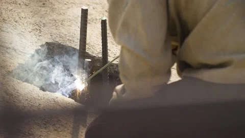 Construction worker makes welding of reinforcement Stock Footage 160469809