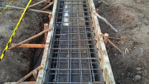 Construction worker making and assembling iron reinforcement for floor slab.. Stock Photos
